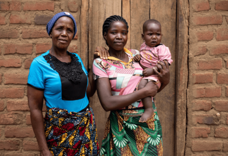 Two African women, one holding a baby